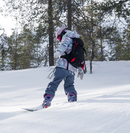 Child snowboarding at Pyhä Ski Resort 