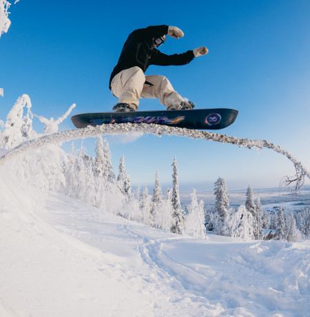 Mikko Rehnberg riding a tree feature at Pyhä Ski Resort