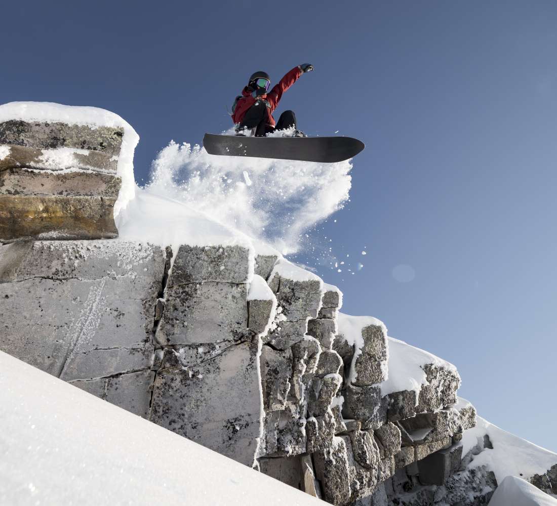 Snowboarder dropping in Pyhätunturi Finland 
