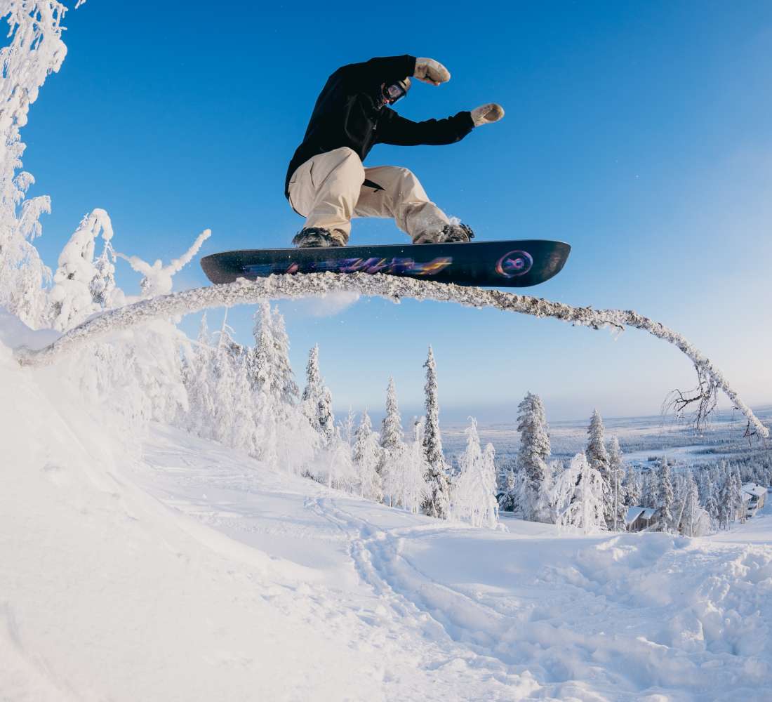 Mikko Rehnberg riding a tree feature at Pyhä Ski Resort