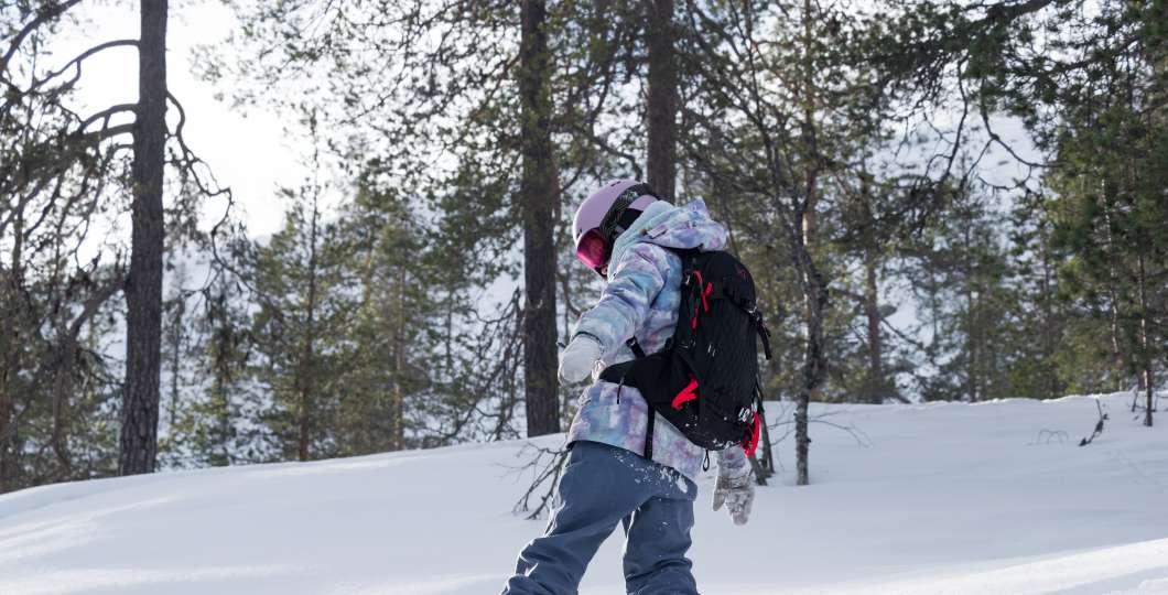 Child snowboarding at Pyhä Ski Resort 